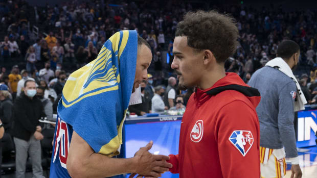 November 8, 2021; San Francisco, California, USA; Golden State Warriors guard Stephen Curry (30) and Atlanta Hawks guard Trae Young (11) talk after the game at Chase Center. Mandatory Credit: Kyle Terada-USA TODAY Sports